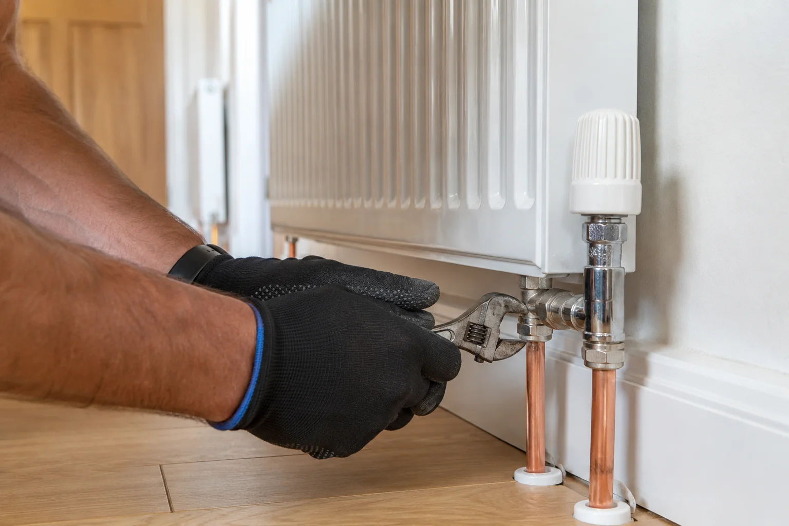 Press-fitting a copper joint on a central heating installation in Ireland