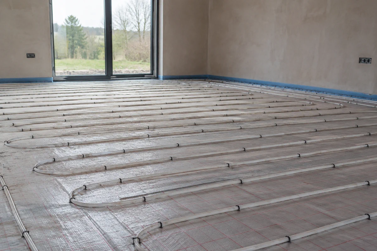 Underfloor heating pipework being installed